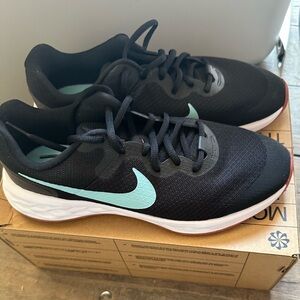 Nike Black and Blue Athletic Shoes with Sleek Design